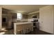 Contemporary kitchen boasts stainless steel appliances, ample cabinets, and an island with barstool seating at 13040 Cedar Elm Lane, Parrish, FL 34219