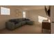 Relaxing media room with sectional sofa, wall-mounted TV, and modern decor at 13040 Cedar Elm Lane, Parrish, FL 34219