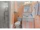 Bathroom features colorful decor, updated lighting, and a shower with glass doors at 1536 Leisure Dr # N4, Bradenton, FL 34207