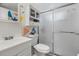 Clean bathroom featuring a glass shower, wall storage, and modern fixtures at 1536 Leisure Dr # N4, Bradenton, FL 34207