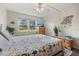 Comfortable bedroom features bright window, closet, dresser, and ceiling fan at 1536 Leisure Dr # N4, Bradenton, FL 34207