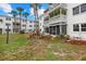 Well-maintained building with screened lanai, balconies, and mature landscaping at 1536 Leisure Dr # N4, Bradenton, FL 34207