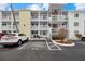 Condo building featuring multiple levels and parking, offering a convenient and accessible living space at 1536 Leisure Dr # N4, Bradenton, FL 34207