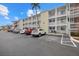 Condo exterior features assigned parking, well-maintained landscaping, and a welcoming entrance at 1536 Leisure Dr # N4, Bradenton, FL 34207