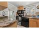 Updated kitchen features granite countertops, stainless steel appliances, and lots of natural light at 1536 Leisure Dr # N4, Bradenton, FL 34207