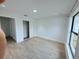 Well-lit bedroom with tile flooring, closet, and large window allowing ample natural light at 1541 Music Ln, North Port, FL 34286
