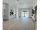 Spacious living room with tile flooring and sliding glass doors for plenty of natural light at 1541 Music Ln, North Port, FL 34286