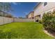 Expansive backyard with lush green grass and a white vinyl fence for privacy and outdoor enjoyment at 1570 Ludington Ave, Wesley Chapel, FL 33543