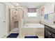 Luxurious bathroom with a separate shower, soaking tub, and stylish fixtures at 1570 Ludington Ave, Wesley Chapel, FL 33543