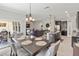 Open concept living space with a dining area, kitchen and living room at 1570 Ludington Ave, Wesley Chapel, FL 33543
