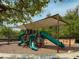 Well-maintained playground with slides and shaded seating at 1570 Ludington Ave, Wesley Chapel, FL 33543