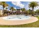 Community splash pad with several palm trees and covered seating for a fun Gathering atmosphere at 1570 Ludington Ave, Wesley Chapel, FL 33543