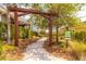 Scenic walking path through a lush, landscaped community area at 1570 Ludington Ave, Wesley Chapel, FL 33543