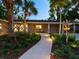 Charming single-story home featuring a landscaped front yard and inviting walkway at 1764 Floyd St, Sarasota, FL 34239
