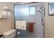Bathroom featuring glass shower door and white tiled walls at 1838 Sunny Dr # D35, Bradenton, FL 34207