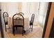 Bright dining nook with white vertical blinds and tile flooring at 1838 Sunny Dr # D35, Bradenton, FL 34207
