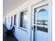 Inviting condo exterior with a well-lit entrance, featuring a decorated front door and clean, accessible design at 1838 Sunny Dr # D35, Bradenton, FL 34207