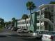 Three-story apartment complex with palm trees and parking at 1838 Sunny Dr # D35, Bradenton, FL 34207