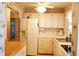 Well-maintained kitchen with white cabinets, countertops, and appliances at 1838 Sunny Dr # D35, Bradenton, FL 34207