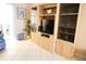 Living area featuring a built-in media center and comfortable furnishings at 1838 Sunny Dr # D35, Bradenton, FL 34207
