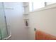 Modern bathroom shower with white tiled walls and recessed corner shelving, offering a clean, minimalist design at 1838 Sunny Dr # D35, Bradenton, FL 34207