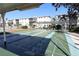 Community shuffleboard court with well-maintained playing surfaces in a serene setting for leisurely outdoor activities at 1838 Sunny Dr # D35, Bradenton, FL 34207