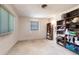 Simple bedroom offers lots of space, carpeted floors, and built-in storage shelving at 18422 Burkholder Cir, Port Charlotte, FL 33948