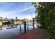 Private boat lift on the canal, offering convenient waterfront access and picturesque scenery at 18422 Burkholder Cir, Port Charlotte, FL 33948