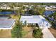 Waterfront home with a metal roof, lush landscaping, screened in lanai and easy access to the canal at 18422 Burkholder Cir, Port Charlotte, FL 33948