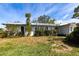 Charming single-story home featuring a well-maintained lawn and mature landscaping at 18422 Burkholder Cir, Port Charlotte, FL 33948