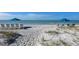 Beautiful beach with beach chairs and umbrellas perfect for relaxing and enjoying the ocean breeze at 1935 Gulf Of Mexico Dr # G7-402, Longboat Key, FL 34228