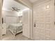 Inviting bedroom view showcasing bright lighting, stylish furniture, closet, and exterior entry at 1935 Gulf Of Mexico Dr # G7-402, Longboat Key, FL 34228