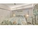 Comfortable bedroom featuring coastal decor, ceiling fan, closet, ambient lighting, and stylish furnishings at 1935 Gulf Of Mexico Dr # G7-402, Longboat Key, FL 34228
