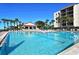 Expansive community pool with ample seating and a nearby clubhouse for endless enjoyment at 1935 Gulf Of Mexico Dr # G7-402, Longboat Key, FL 34228
