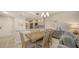 Open dining area featuring stylish furnishings and a view into the modern kitchen at 1935 Gulf Of Mexico Dr # G7-402, Longboat Key, FL 34228