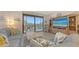 Inviting living room with coastal decor and a seamless transition to the outdoor balcony at 1935 Gulf Of Mexico Dr # G7-402, Longboat Key, FL 34228