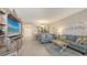 Open-concept living area blending seamlessly with the dining and kitchen spaces at 1935 Gulf Of Mexico Dr # G7-402, Longboat Key, FL 34228