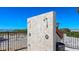 Convenient outdoor shower area with dual shower heads and privacy screen near the beach at 1935 Gulf Of Mexico Dr # G7-402, Longboat Key, FL 34228