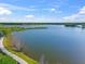 Scenic aerial view of the lake with a paved walking path at 2259 Midnight Pearl Dr, Sarasota, FL 34240