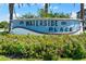 Waterside Place entrance sign surrounded by flowering bushes at 2259 Midnight Pearl Dr, Sarasota, FL 34240