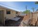 Relaxing fenced backyard has mulch and stone ground cover with a patio and mature trees at 2316 Bradford St, Sarasota, FL 34231