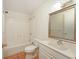 Bright bathroom with a shower-tub combo and a large mirror above the vanity at 2316 Bradford St, Sarasota, FL 34231
