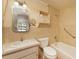 This neutral bathroom features a shower-tub combination and ample storage space at 2316 Bradford St, Sarasota, FL 34231
