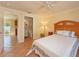 Bright bedroom with tile floors features a wood headboard and view to bathroom and kitchen at 2316 Bradford St, Sarasota, FL 34231