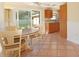 Open dining area with access to both the kitchen and outdoor patio space at 2316 Bradford St, Sarasota, FL 34231