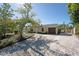 Charming single-story home featuring a well-kept lawn and a brown garage door at 2316 Bradford St, Sarasota, FL 34231