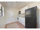 Compact kitchen featuring white cabinets and essential appliances at 2316 Bradford St, Sarasota, FL 34231