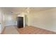 Open living area with tile floors leading to the kitchen and bathroom at 2316 Bradford St, Sarasota, FL 34231