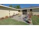 Outdoor patio features a stone fire pit and comfortable seating area at 2316 Bradford St, Sarasota, FL 34231