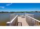 Community pier seating offers an idyllic spot to unwind and admire the tranquil lake scenery at 25275 Rampart Blvd # 1203, Punta Gorda, FL 33983